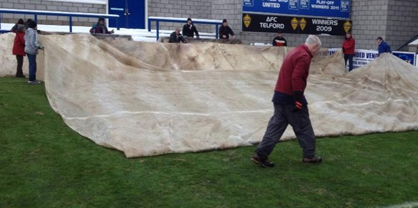As the last of the covers come off, the referee passes pitch as fit to play