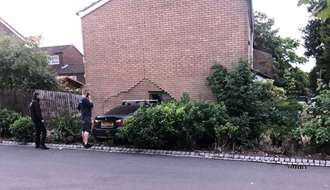 Two taken to hospital as BMW smashes into house