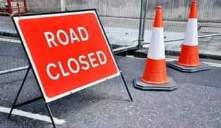 May be an image of road and text that says "ROAD CLOSED"